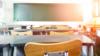 photo of school desks in empty classroom