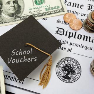 photo of graduation cap, diploma, and money